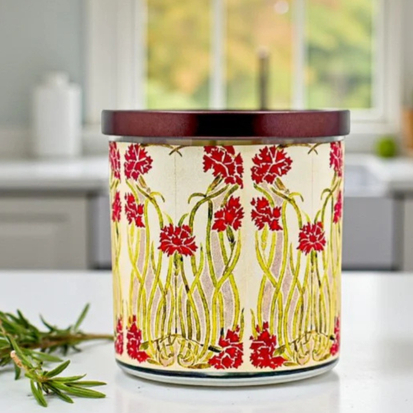 Decorative candle with floral design on a kitchen counter
