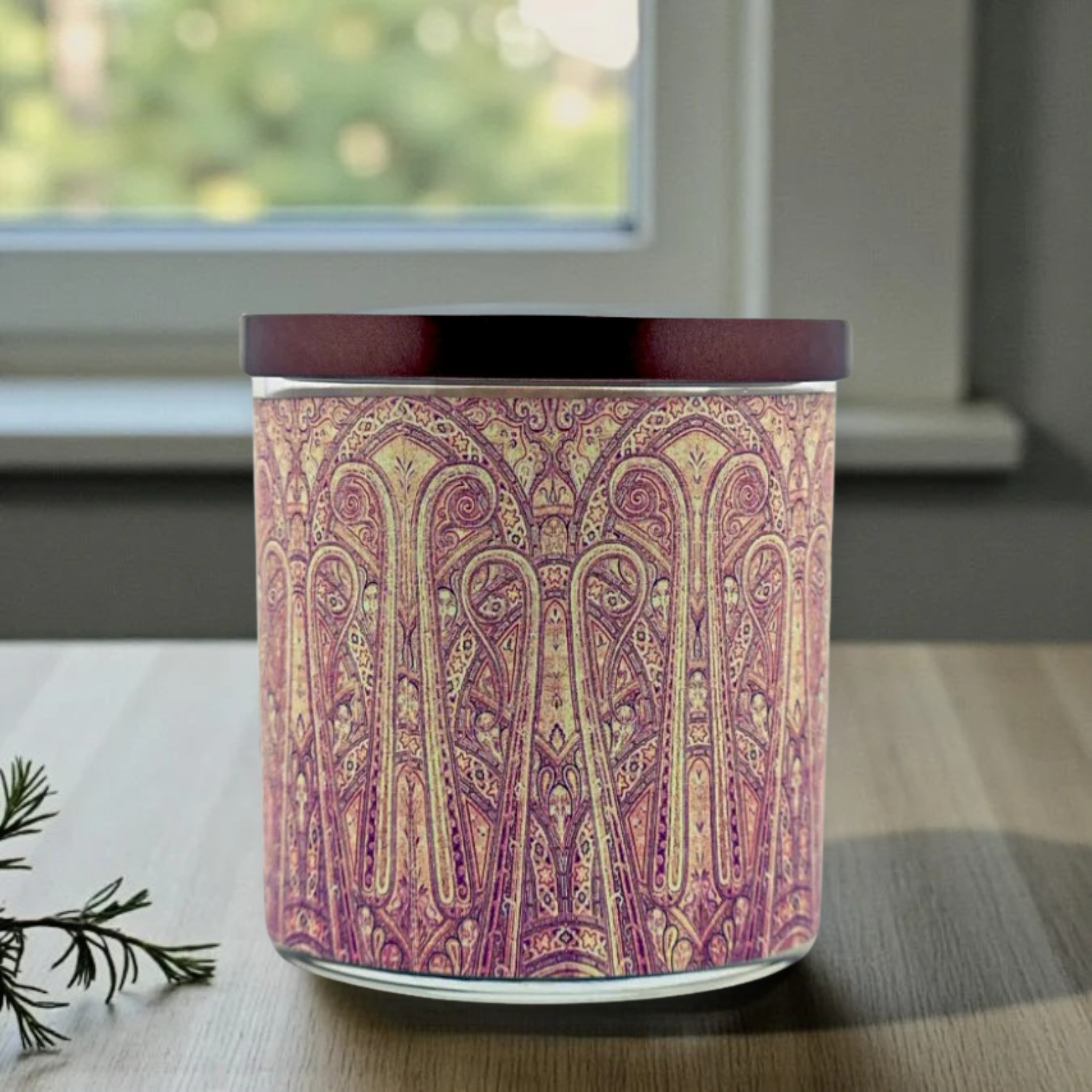 Decorative candle with intricate pattern on a wooden surface