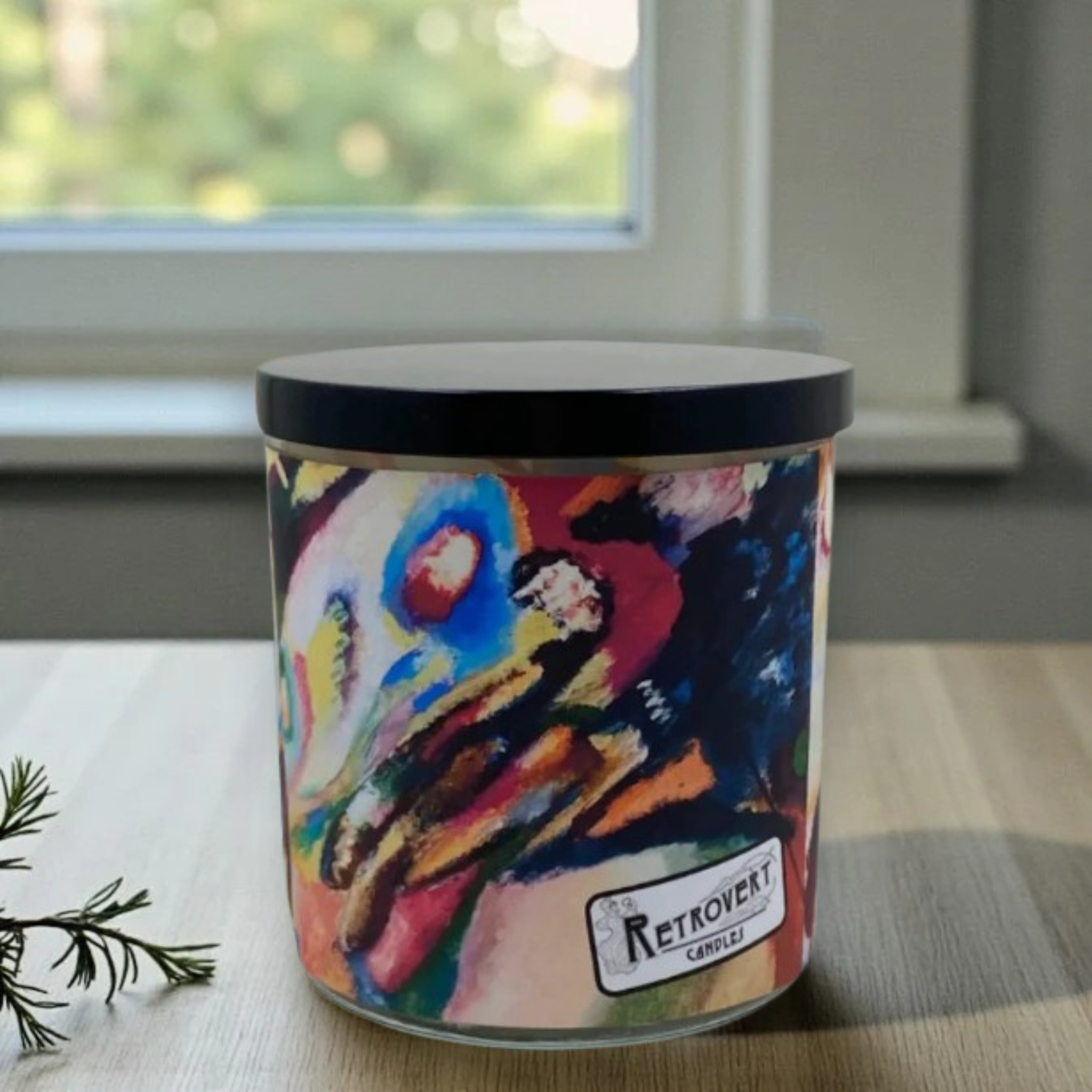 Colorful candle with a hand design and 'Retrovert' label.